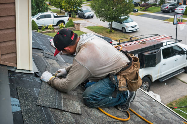 Professional Roof Replacement technician working in Sand Springs, MT